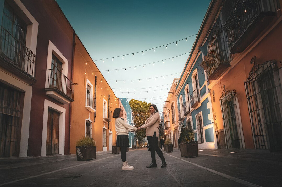 Two Mexican business professionals shaking hands after closing a deal